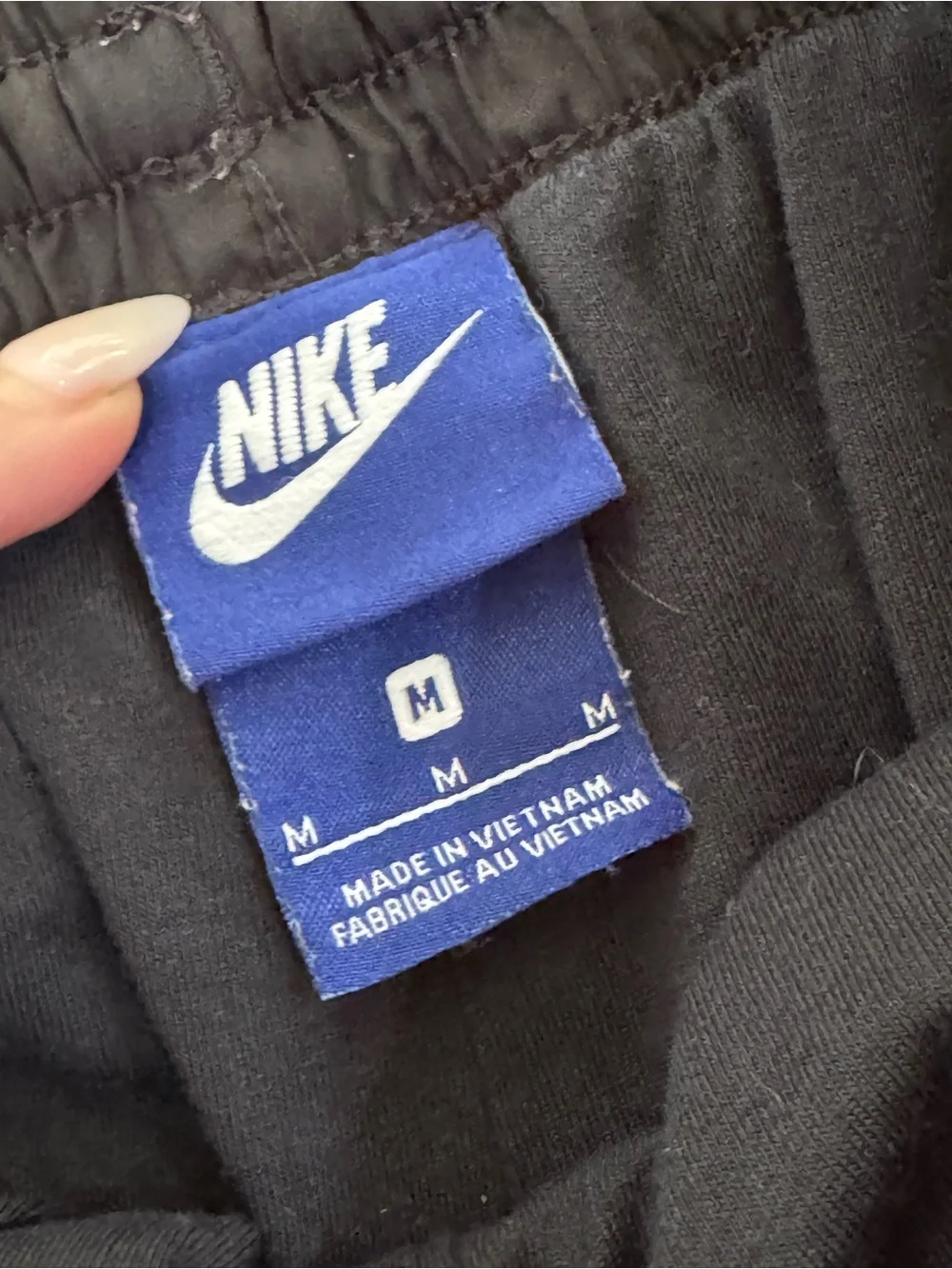 Nike Black Joggers with White Logo and Side Accents